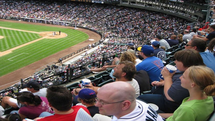 Ronald Acuña Jr. sliding into home plate, showcasing his speed and agility in the MLB Playoffs 2024.