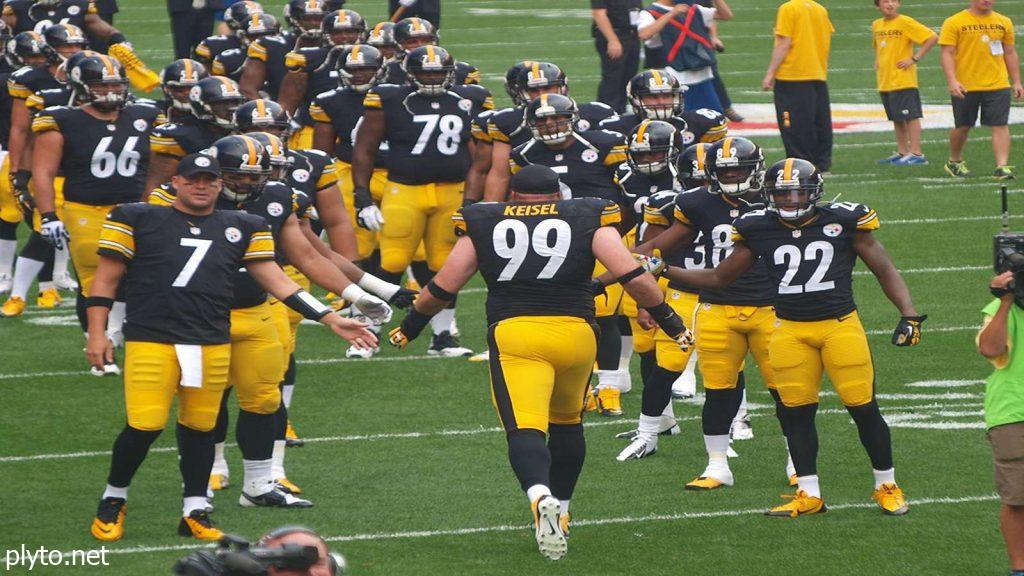 Russell Wilson throwing a pass during his debut game with the Pittsburgh Steelers.