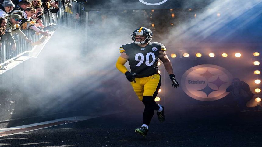 Pittsburgh Steelers players celebrating a touchdown scored by Russell Wilson.