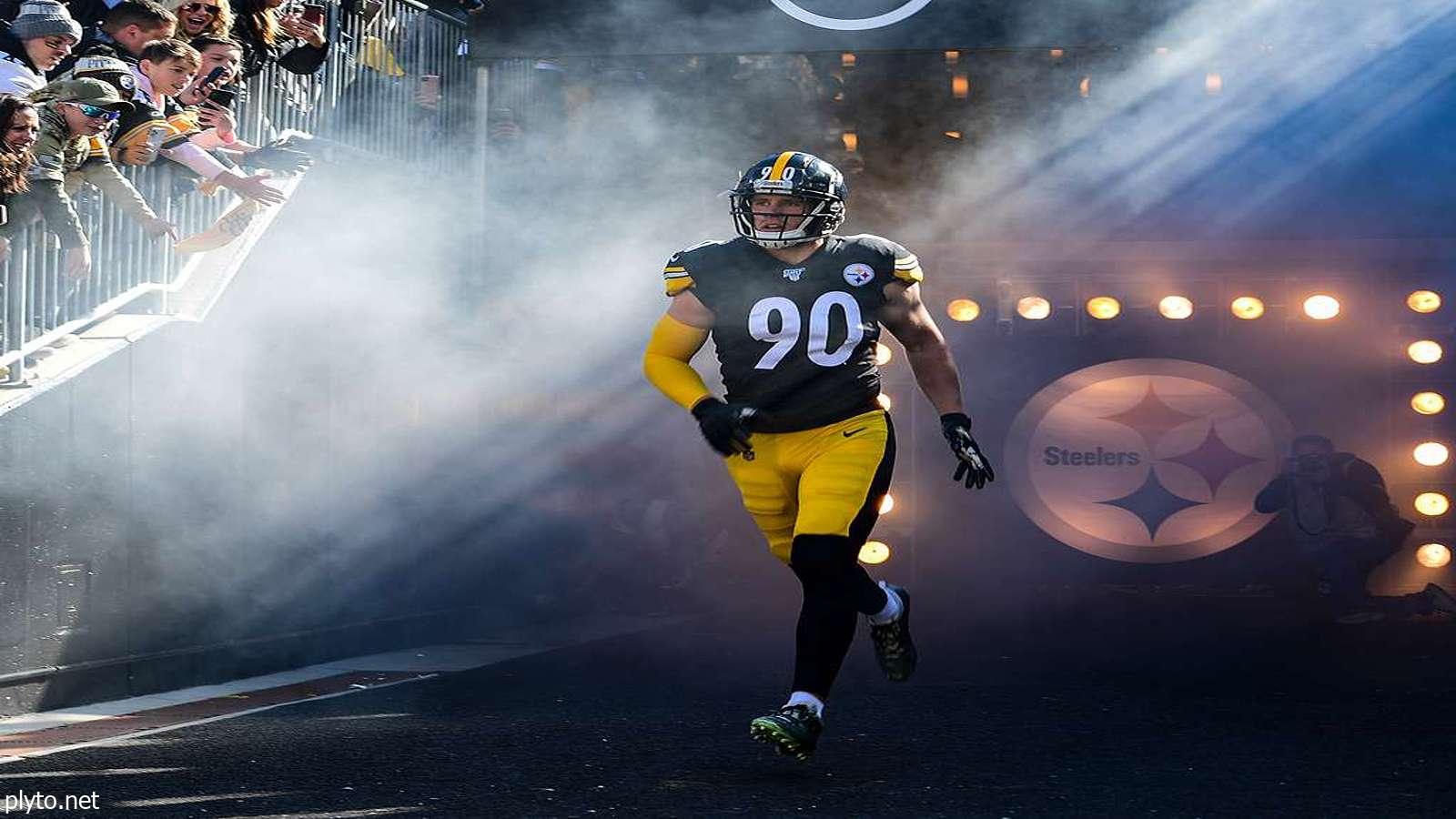 Pittsburgh Steelers players celebrating a touchdown scored by Russell Wilson.