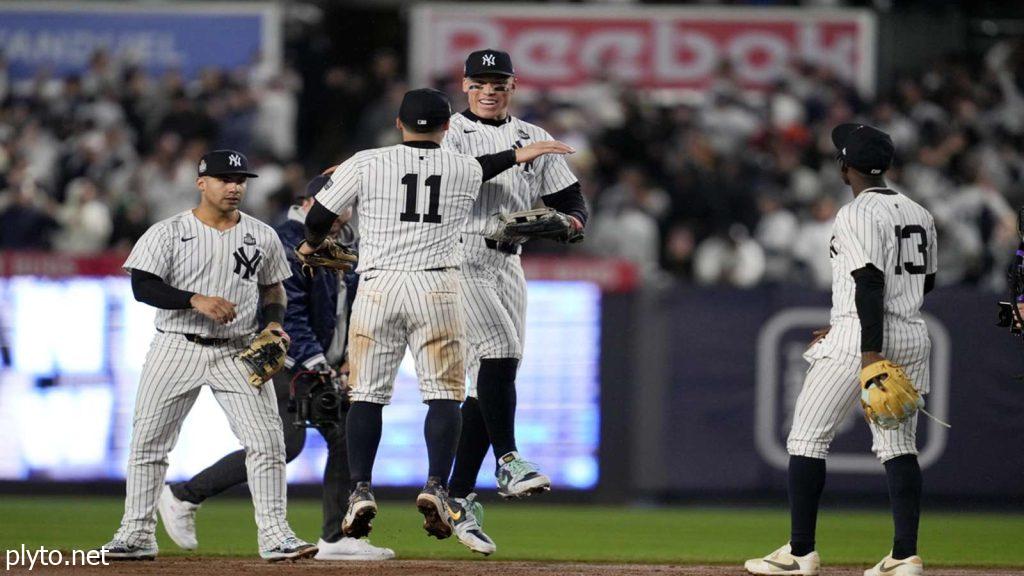 Aaron Judge at bat during a high-pressure playoff game, showcasing his intense focus and determination amidst fans cheering in the background.