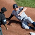 Aaron Judge celebrating with teammates after a crucial home run, symbolizing hope and resilience for the New York Yankees in the 2024 playoffs.