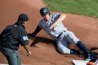 Aaron Judge celebrating with teammates after a crucial home run, symbolizing hope and resilience for the New York Yankees in the 2024 playoffs.