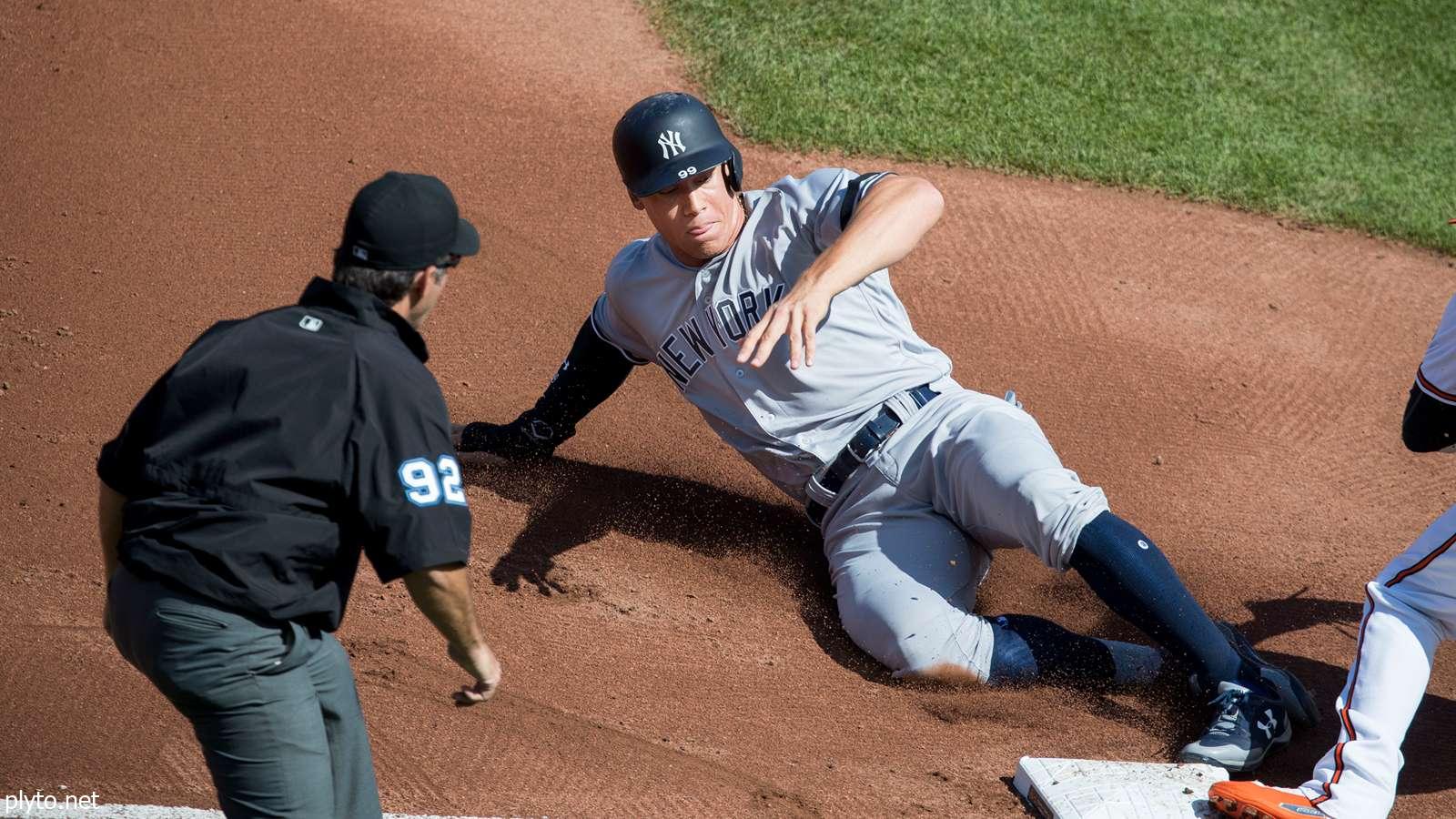 Aaron Judge celebrating with teammates after a crucial home run, symbolizing hope and resilience for the New York Yankees in the 2024 playoffs.