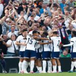 Fans at Wembley cheering during the England vs Ireland Nations League clash, creating a vibrant atmosphere.