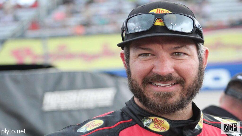 A reflective Martin Truex Jr. after his final NASCAR race, symbolizing the end of an era.