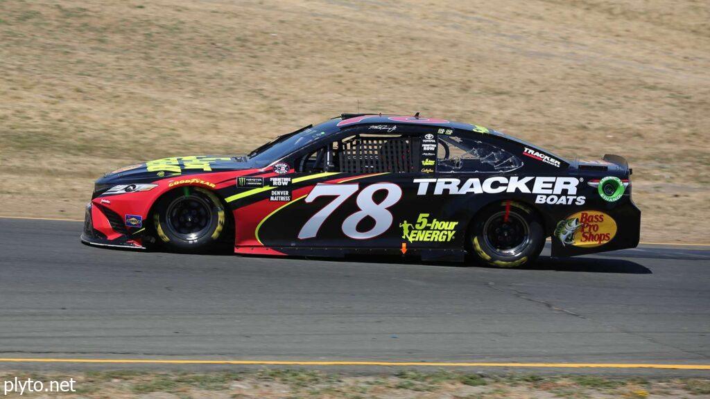 Truex crossing the finish line during one of his many victories in NASCAR.