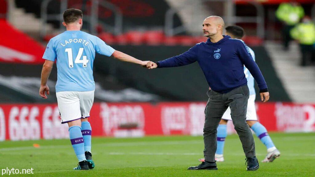 Pep Guardiola celebrating Manchester City's Premier League victory with fans and players.