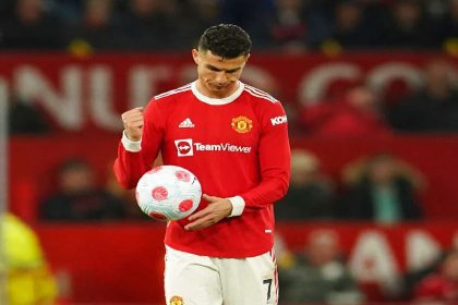 Cristiano Ronaldo lifting a major trophy with Manchester United after winning a league title.