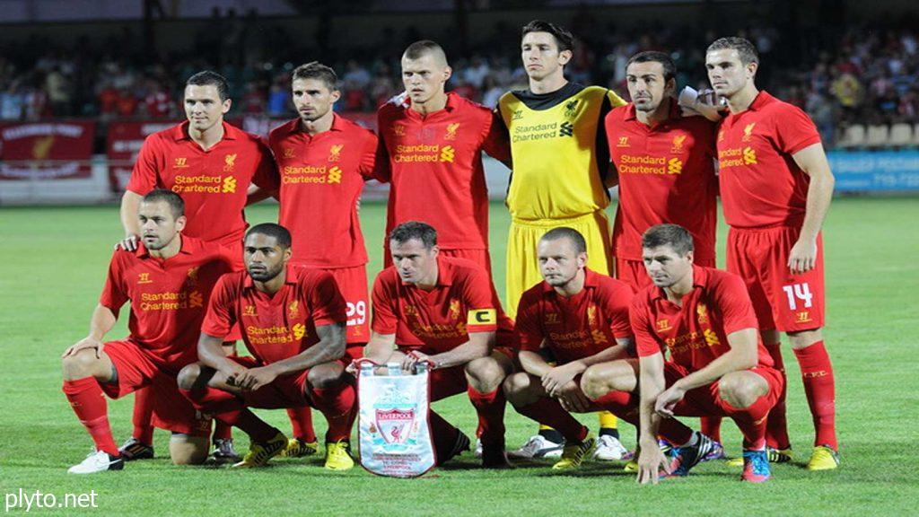 A vibrant scene of Liverpool FC fans outside Anfield Stadium, showcasing the passionate support surrounding the club amid ongoing transfer rumors.