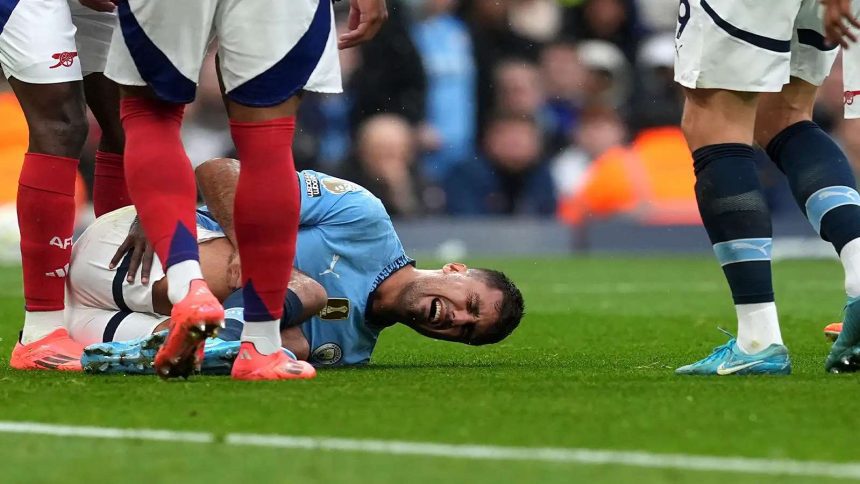 Manchester City manager Pep Guardiola discussing injury concerns at a press conference