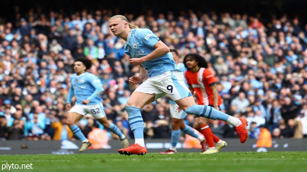 Pep Guardiola strategizing during a Manchester City match amid an injury-ridden season