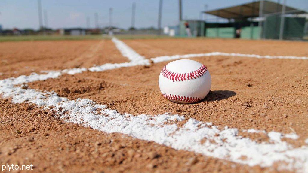 A baseball bat and ball resting on a field, reflecting the excitement and uncertainty surrounding MLB free agency rumors and offseason strategies.