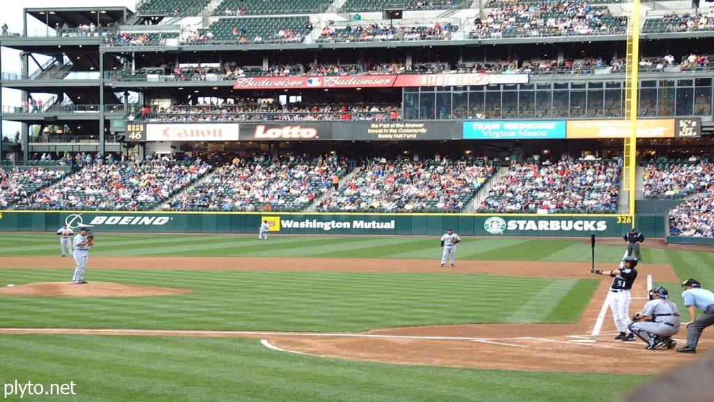 Los Angeles Angels stadium bustling with fans, highlighting the team's efforts to address MLB free agency rumors and improve their roster for the upcoming season.