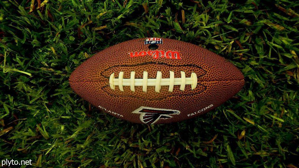 Aerial view of a football field, symbolizing the competitive landscape of the NFL and the impact of trades.