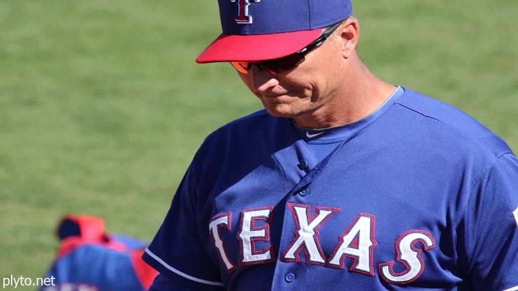 Fans in Rangers gear cheering wildly during the decisive Game 5 of the 2024 World Series.